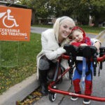 Jessica Hellard is helping distribute free Treat Accessible signs in Kingston, Ont. to help make Halloween and trick or treating more accessible to families like hers, seen here with her two-year old son Lachlan on Friday, October 18, 2019. (Julia McKay/The Whig-Standard/Postmedia Network)