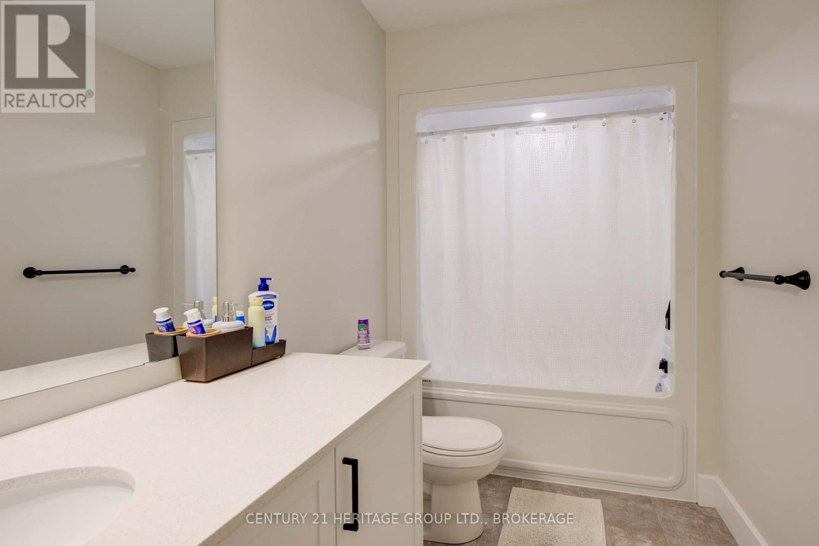 28 Dusenbury Drive, Loyalist, Ontario K0H 2H0 - Photo 42 - X12308183